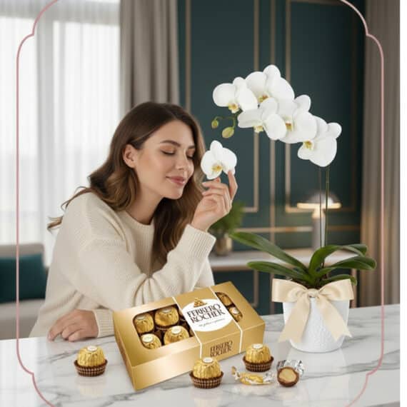 Mujer joven y elegante admirando una orquídea Phalaenopsis blanca con chocolates Ferrero Rocher en un ambiente de hogar lujos